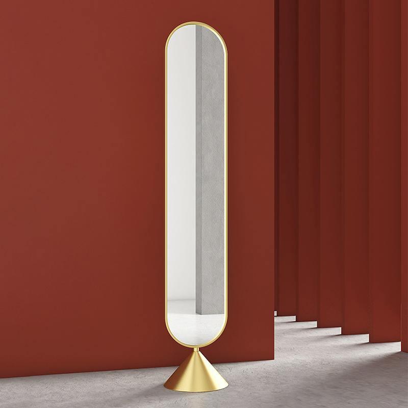 Boxford gold full-length mirror against a terracotta wall